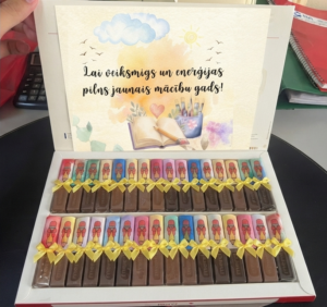 “Merci” šokolādes konfekšu un iepakojuma noformējums